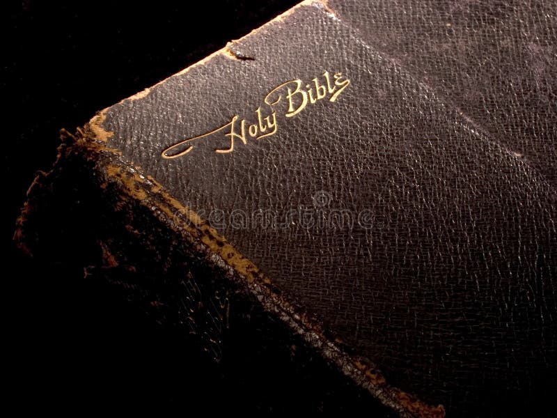 Bible on Black 1. Tattered, old, black leather Holy Bible on black background Bible on Black 1. Tattered, old, black leather Holy Bible on black background
