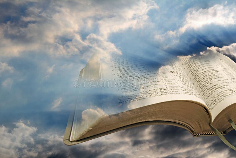 Photo of open bible pages against a stormy sky and blue sun rays shining through pages of bible. Photo of open bible pages against a stormy sky and blue sun rays shining through pages of bible.