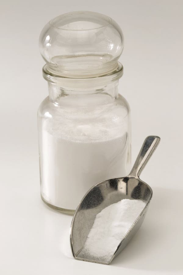 Sodium bicarbonate in a pharmaceutical glass jar. White background. Sodium bicarbonate in a pharmaceutical glass jar. White background.