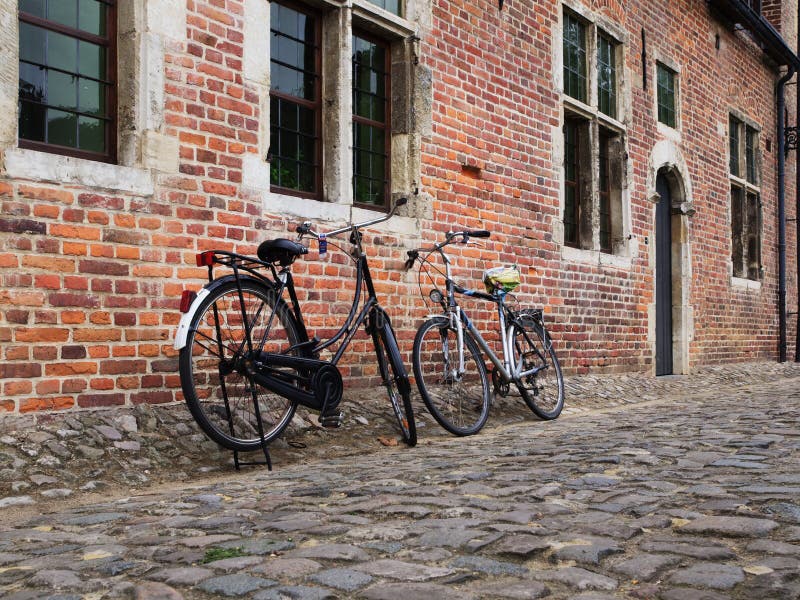 Old Bicycles leaned against old houses in Leuven, Belgium. Old Bicycles leaned against old houses in Leuven, Belgium