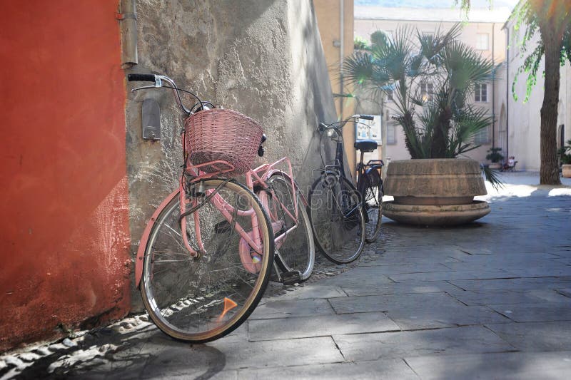 Bicycles on a sunny street in Finalborgo, an Italian medieval town on the Ligurian coast. Bicycles on a sunny street in Finalborgo, an Italian medieval town on the Ligurian coast.