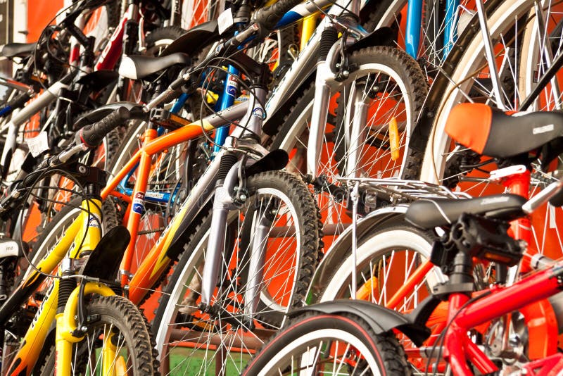 A lot of multi-coloured bicycles for sale. A lot of multi-coloured bicycles for sale.