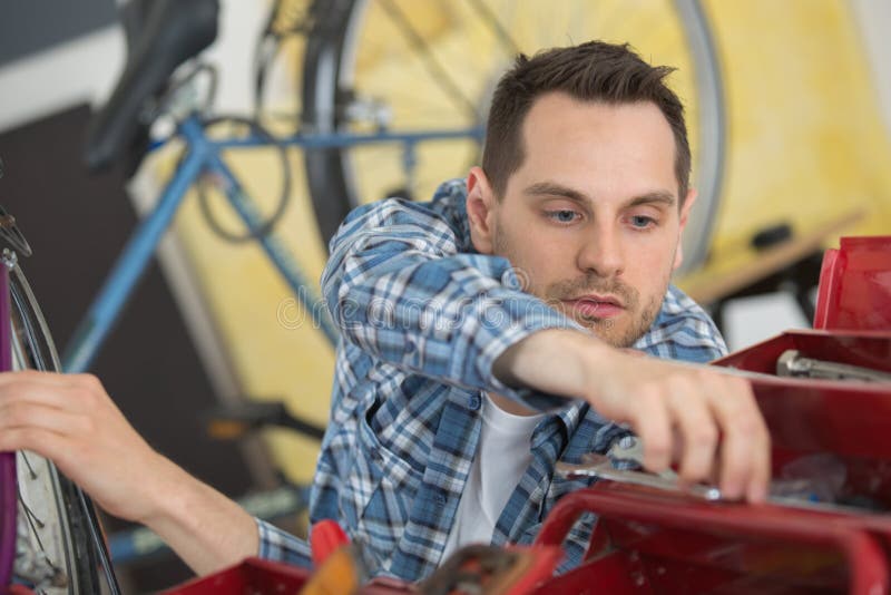 Bicycle assembler at work stock image. Image of bicycle 259237791