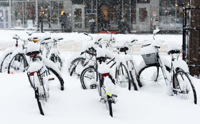 Bicycle completely covered with snow parked in central of Stockholm royalty free stock image Bicycle completely covered with snow parked in central of Stockholm royalty free stock image