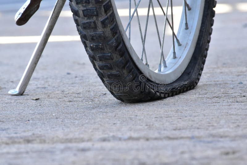 Bicycle flat tires stock image. Image of accident, city 187779409