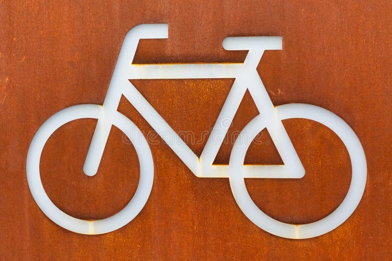 White bicycle sign on a corten steel rusted background