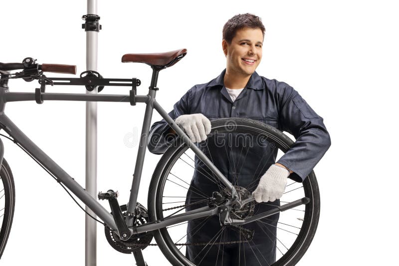 Bicycle Mechanic Fixing a Bicycle Wheel and Smiling Stock Image Image