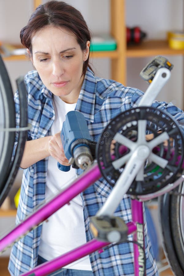 Bicycle Mechanic Repairing Bike in Stock Image Image of bike
