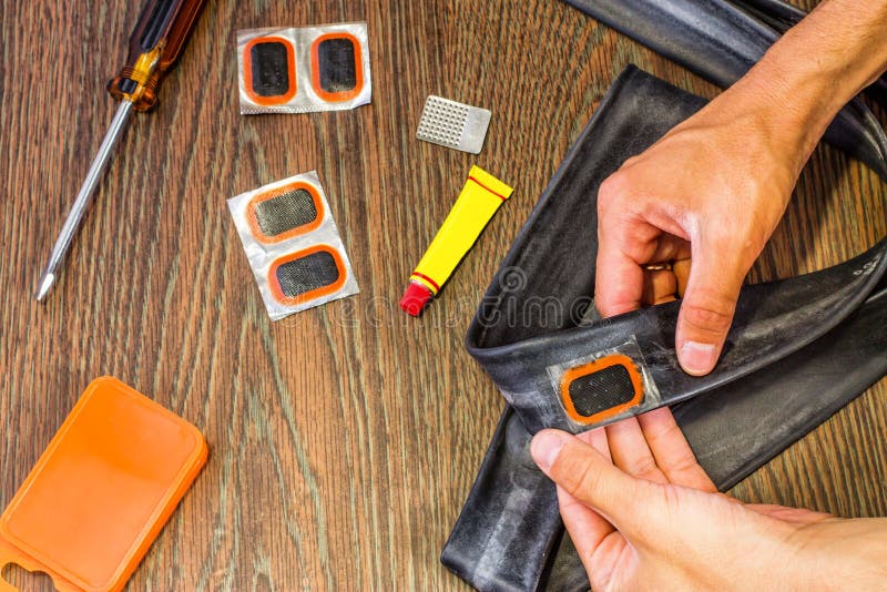 Bicycle Repair Kit, Wheels Camera on a Wooden Background Stock Image