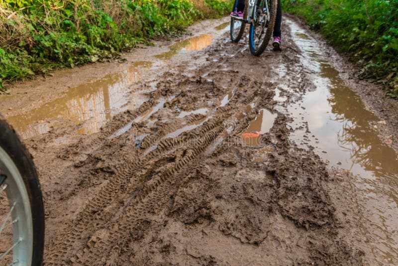 Bicycle Ride through Muddy Dirt Road Stock Photo Image of action