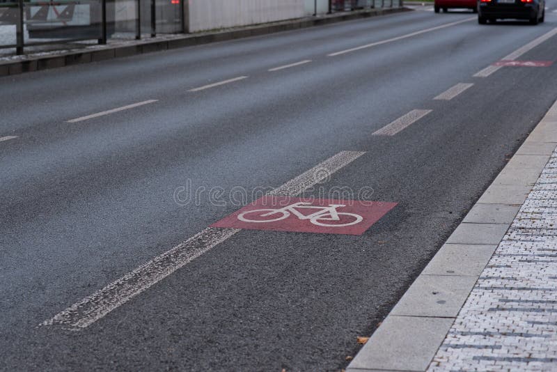 The bicycle sign painted on the asphalt on the city, on Prague 6, Czech Republic.