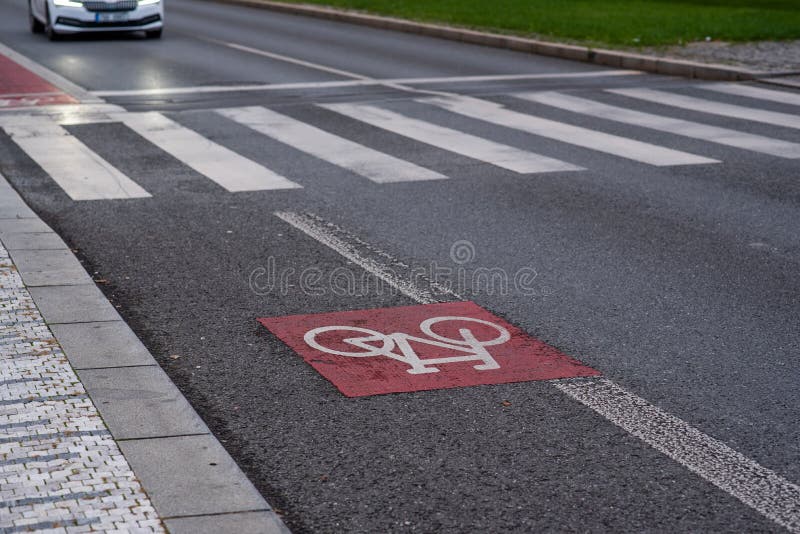 The bicycle sign painted on the asphalt on the city, on Prague 6, Czech Republic.