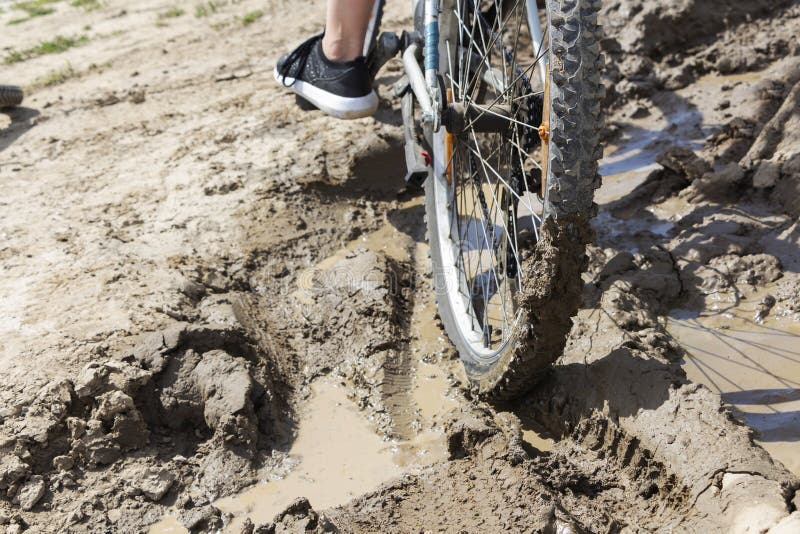 The Bicycle Wheel is Stuck in the Mud. Close Up Stock Photo Image of
