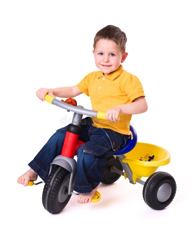 Cute little boy riding a 3-wheel bike. Isolated on white background. Cute little boy riding a 3-wheel bike. Isolated on white background