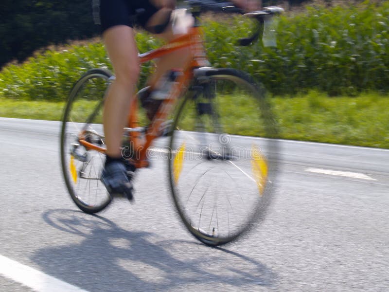 Photo of bicyclist on rural road. Photo of bicyclist on rural road