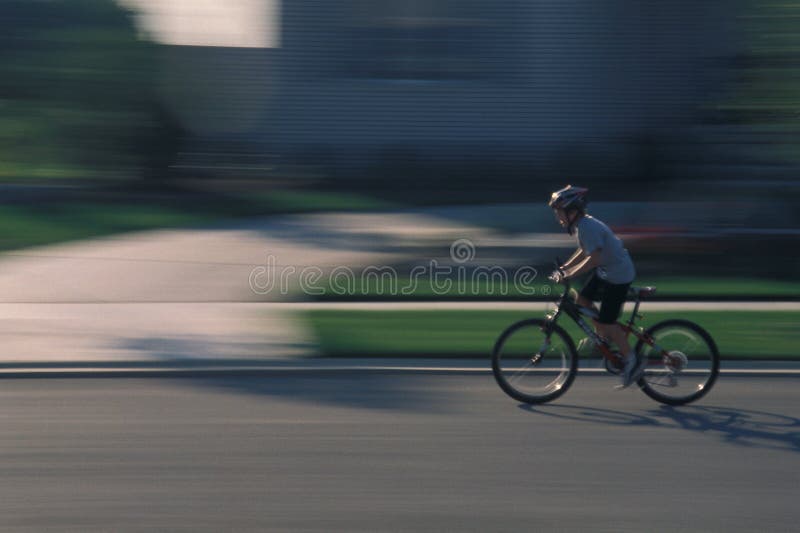 Action shot of child bicycling. Action shot of child bicycling