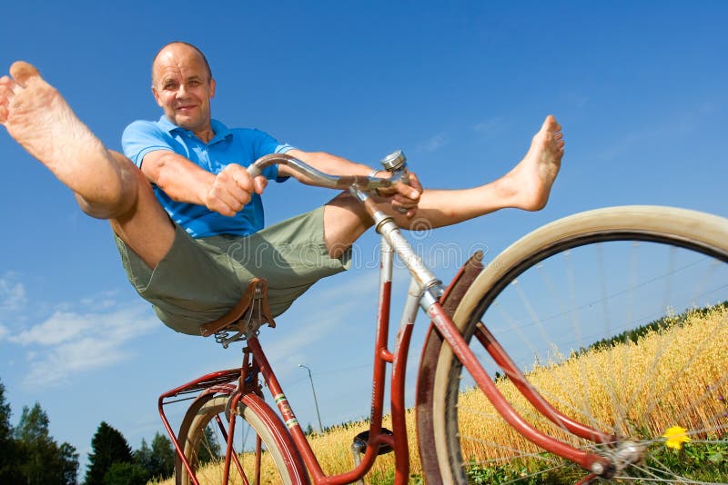 Man bicycling in Finnish countryside. Man bicycling in Finnish countryside.