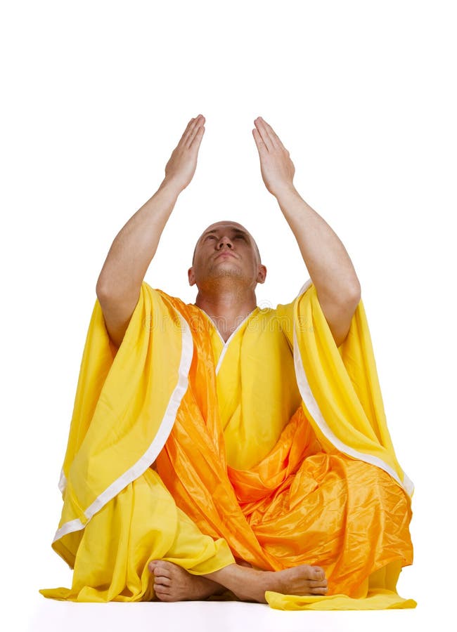 Young praying Buddhist monks. Isolated on white background. Young praying Buddhist monks. Isolated on white background