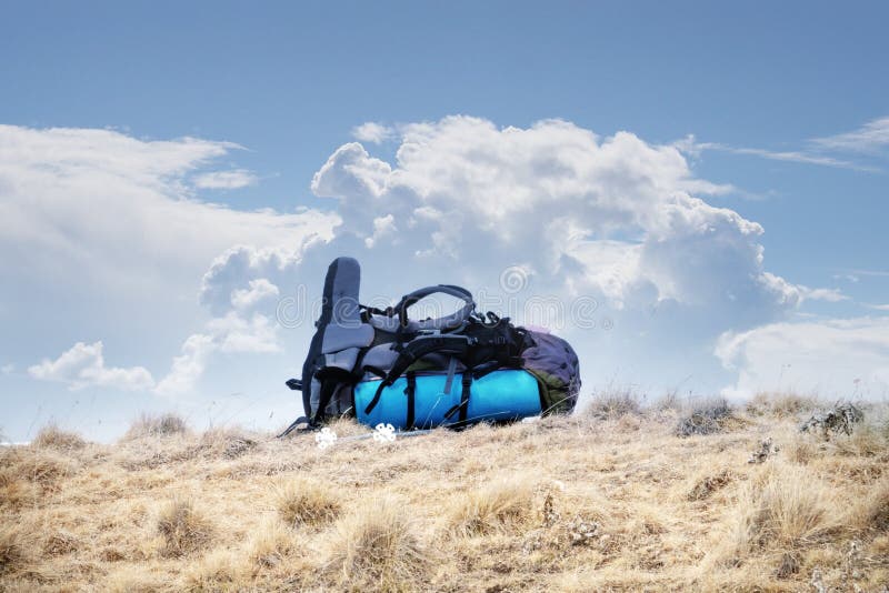 Big backpack in winter in mountains on a halt royalty free stock images