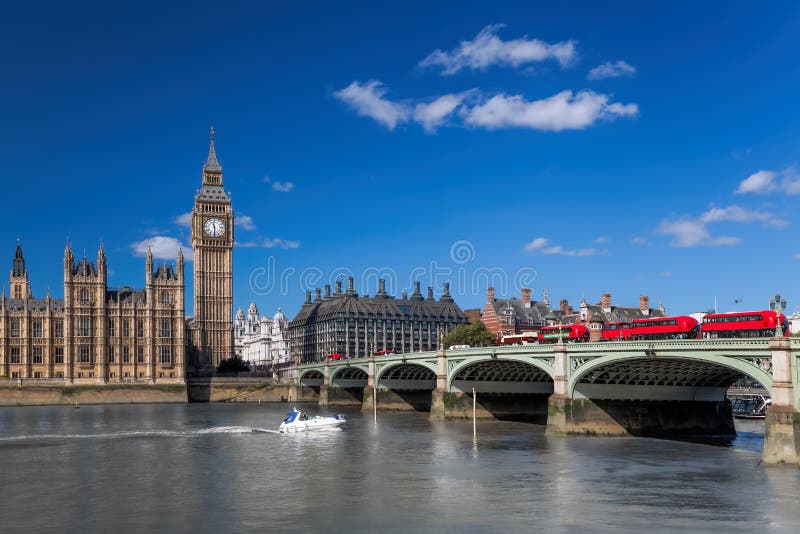 Big Ben with Red Buses on Bridge Over Thames River with Boat in London