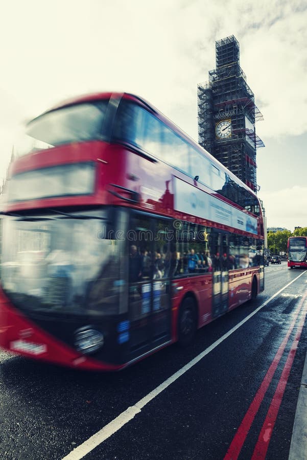 Big Ben Under Conservation Works and Red double decker bus in mo stock images Big Ben Under Conservation Works and Red double decker bus in mo stock images