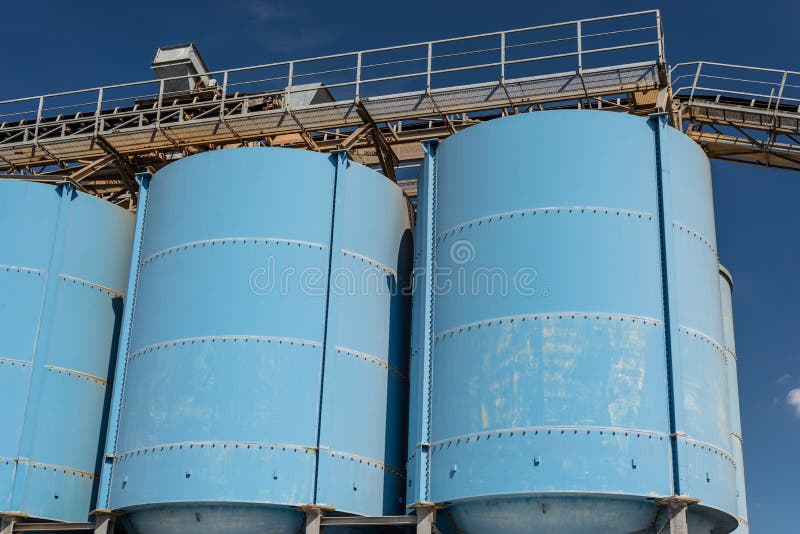 Big Blue Metallic Industrial Silos for the Production of Cement at an ...