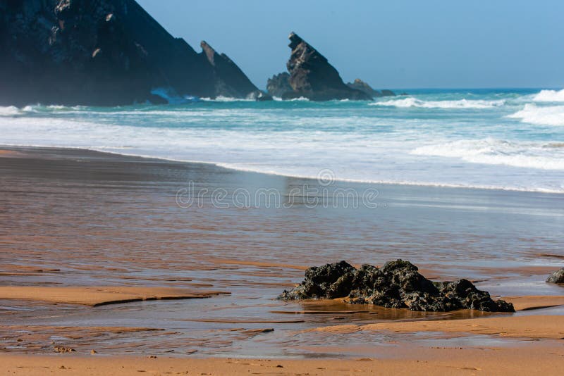 Big breaking Ocean wave on a sandy beach stock photo Big breaking Ocean wave on a sandy beach stock photo