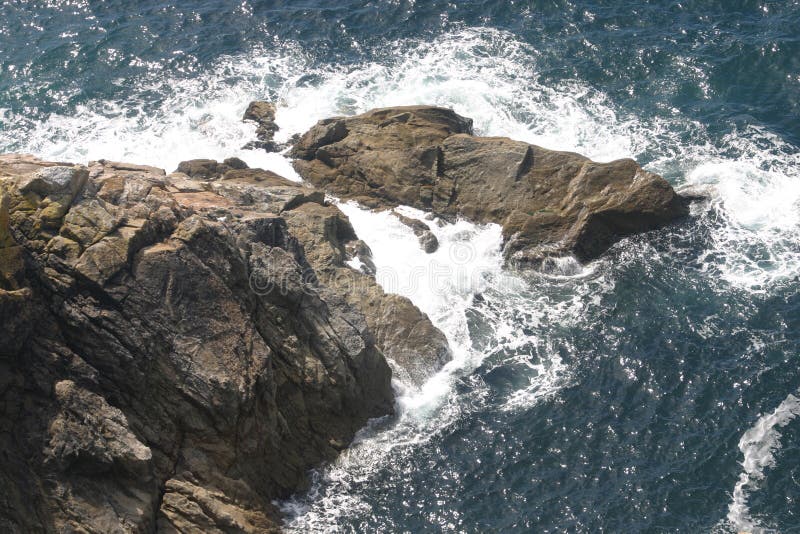 Big brown rocks in the sea