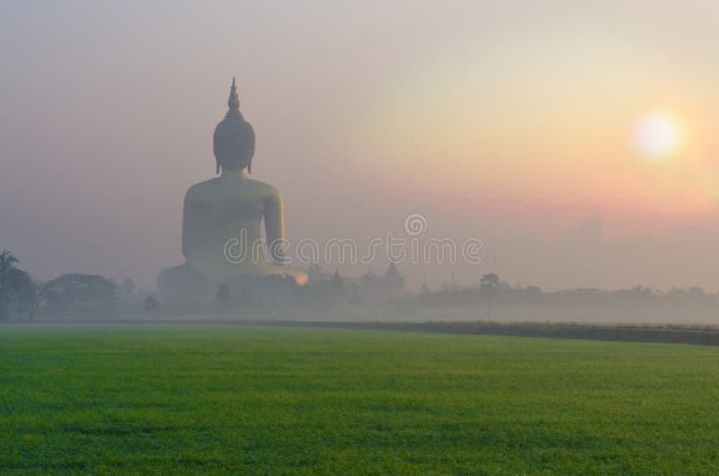 The Big Buddha at Wat Muang Temple with fog