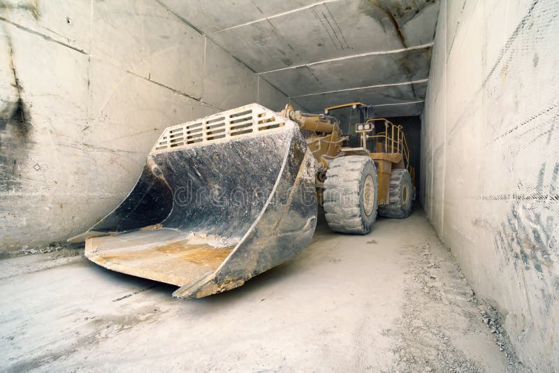Big bulldozer in marble tunnel, Carrara, Italy royalty free stock image Big bulldozer in marble tunnel, Carrara, Italy royalty free stock image