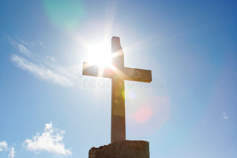 Big christian cross with sun light stock images Big christian cross with sun light stock images