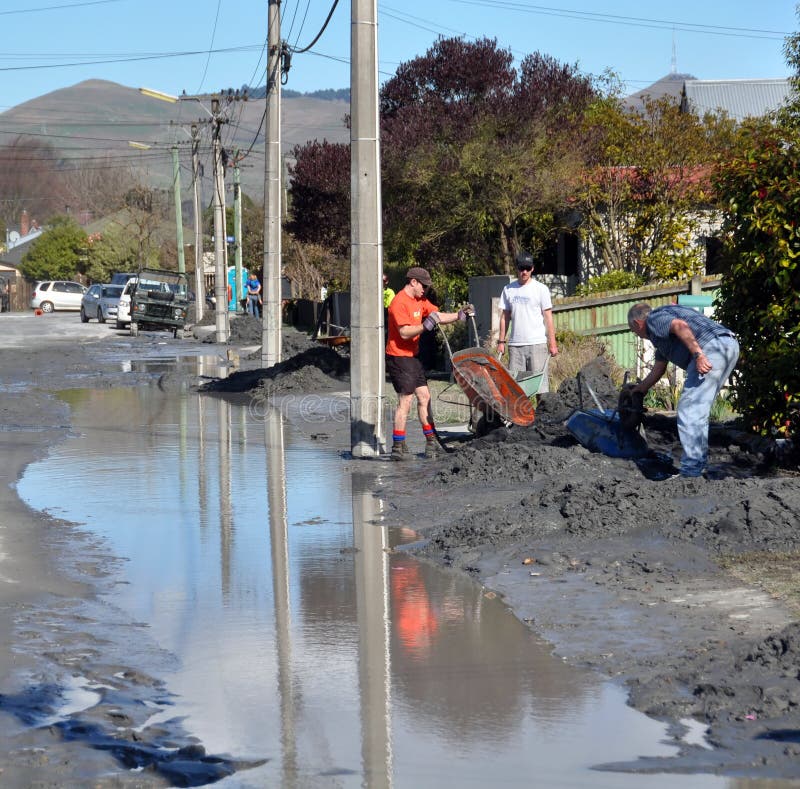 06 September 2010 - Christchurch Earthquake Damage, New Zealand. House holders and neighbours work together on a sunny spring day to clean-up the sand and clay accumulated on properties in the Eastern suburbs. The sand and clay were liquified by the earthquake and expoded through the top soil in geysers. 06 September 2010 - Christchurch Earthquake Damage, New Zealand. House holders and neighbours work together on a sunny spring day to clean-up the sand and clay accumulated on properties in the Eastern suburbs. The sand and clay were liquified by the earthquake and expoded through the top soil in geysers.