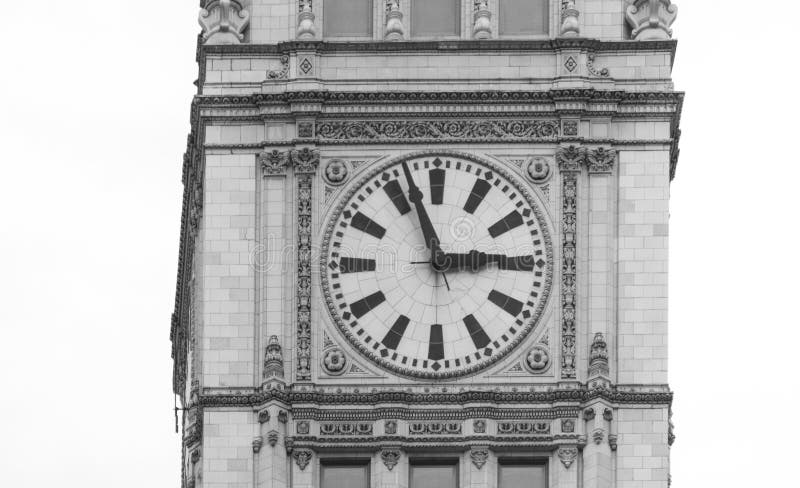 Big clock on a building on a street of Chicago Downtown