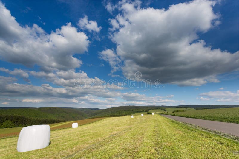 Big cloudscape over a field in Germany. royalty free stock photography