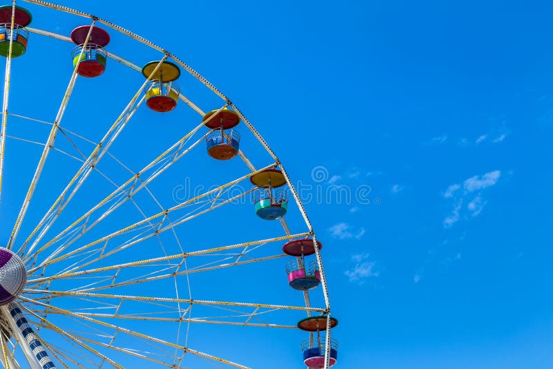 Big colourful ferris wheel in amusement park