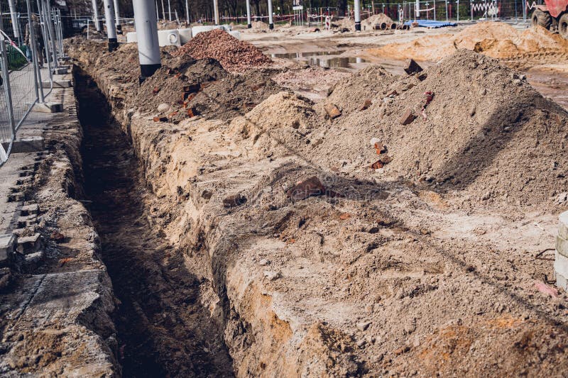 Big Construction Site with Pipes and Wires in the Construction Area ...