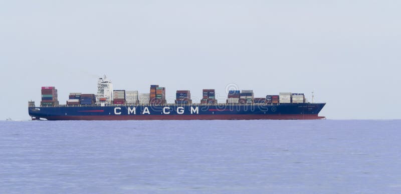 Big Container cargo ship leaving port after loading unloading operations royalty free stock photography.