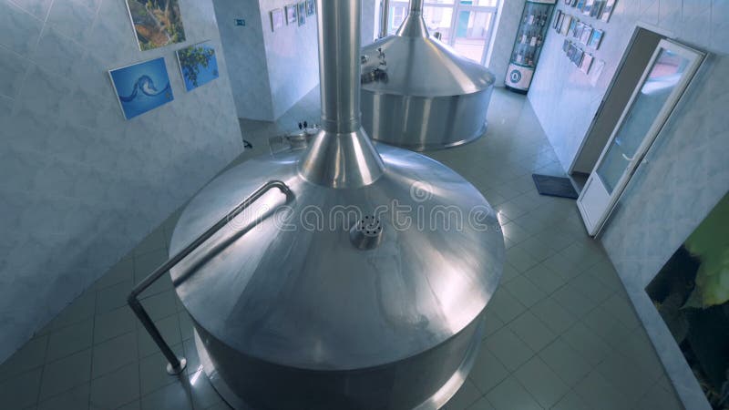 Two tanks for beer at a factory, top view.