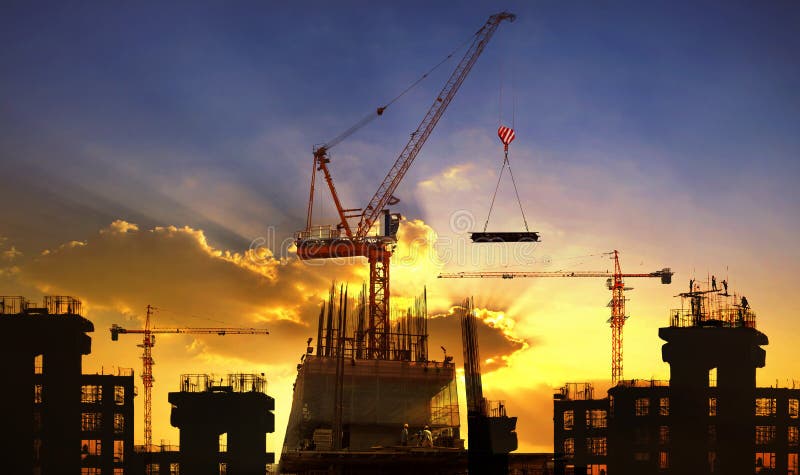 Big crane and building construction against beautiful dusky sky