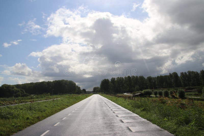 Big cumulus clouds above the meadows and fields of the Zuidplaspolder in the Netherlands. royalty free stock photos Big cumulus clouds above the meadows and fields of the Zuidplaspolder in the Netherlands. royalty free stock photos