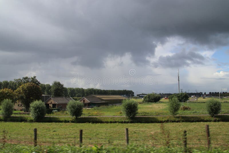 Big cumulus clouds above the meadows and fields of the Zuidplaspolder in the Netherlands. royalty free stock photos Big cumulus clouds above the meadows and fields of the Zuidplaspolder in the Netherlands. royalty free stock photos