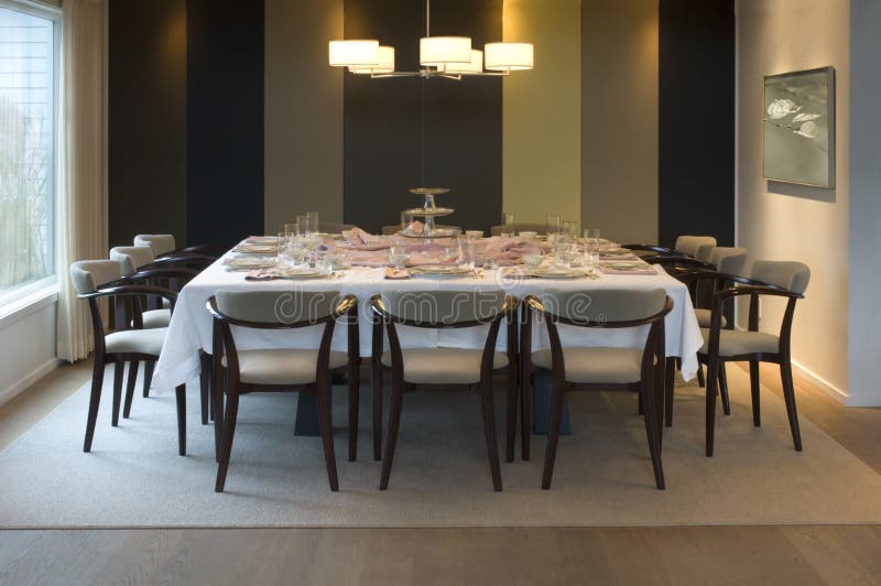 Big Dinner Table Surrounded by Chairs Under the Lamps in the Living Room Stock Image Image of