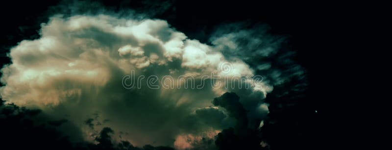 Big dramatic storm cloud probably cumulonimbus at summer twylight beside small moon on the right side royalty free stock photos Big dramatic storm cloud probably cumulonimbus at summer twylight beside small moon on the right side royalty free stock photos