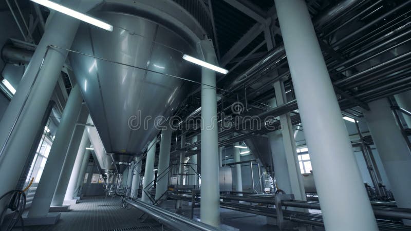Big facility with beer tanks, close up.
