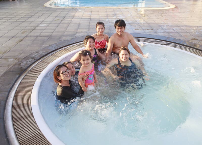Big family people and brothers relaxing in water pool with happ royalty free stock images Big family people and brothers relaxing in water pool with happ royalty free stock images