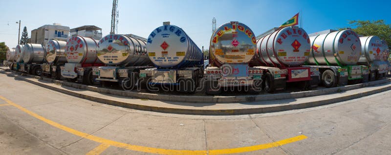 Big fuel gas tanker trucks parked on highway