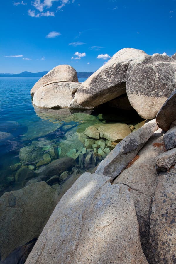 Big granite boulders at pristine lake shore