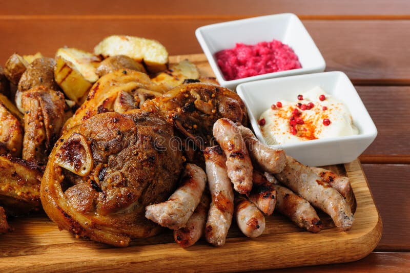 Big grilled meat and vegetables board stock photos Big grilled meat and vegetables board stock photos