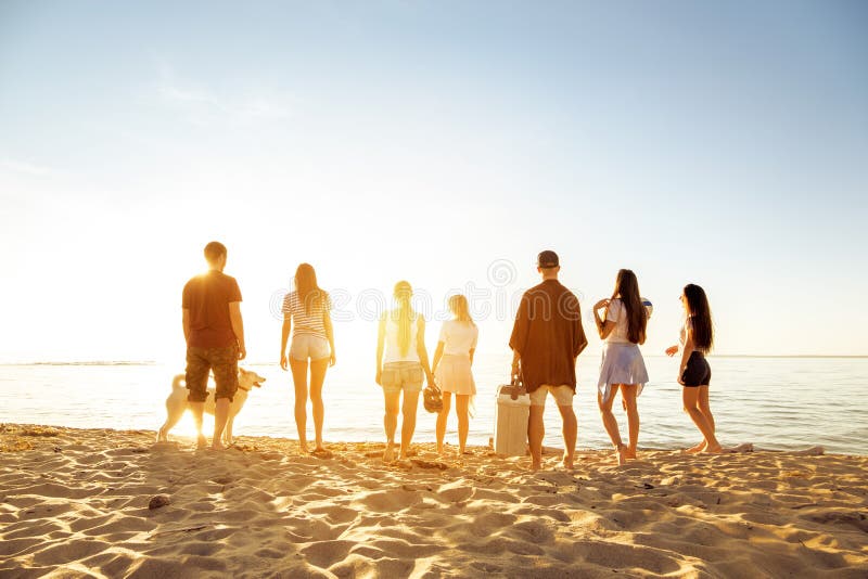 Big group of friends sunset beach picknic stock photography Big group of friends sunset beach picknic stock photography