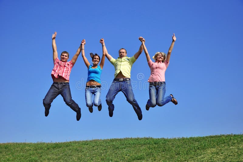 Group of kids jump high over blue sky and clouds, Stock image